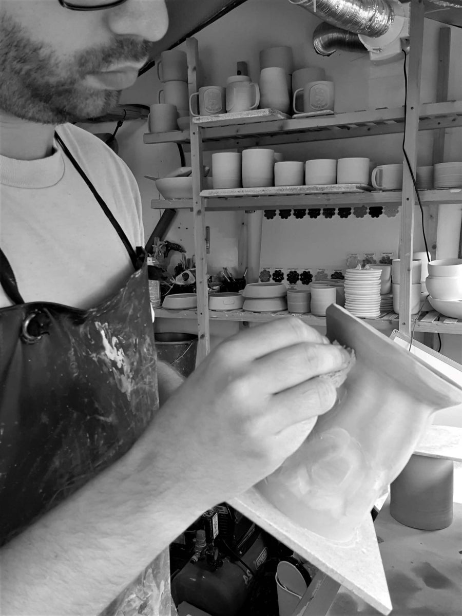 Carving a handmade oil candle burner in hobbs ceramics pottery studio in Bicester, Oxfordshire